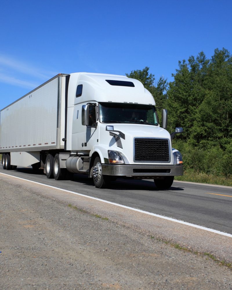 Semi truck on highway hauling freight.